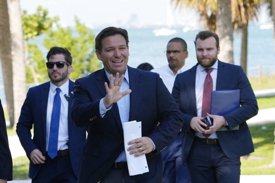 Florida Gov. Ron DeSantis waves as he arrives for a news conference at Bill Baggs Cape Florida State Park, Thursday, Dec. 1, 2022, on Key Biscayne.