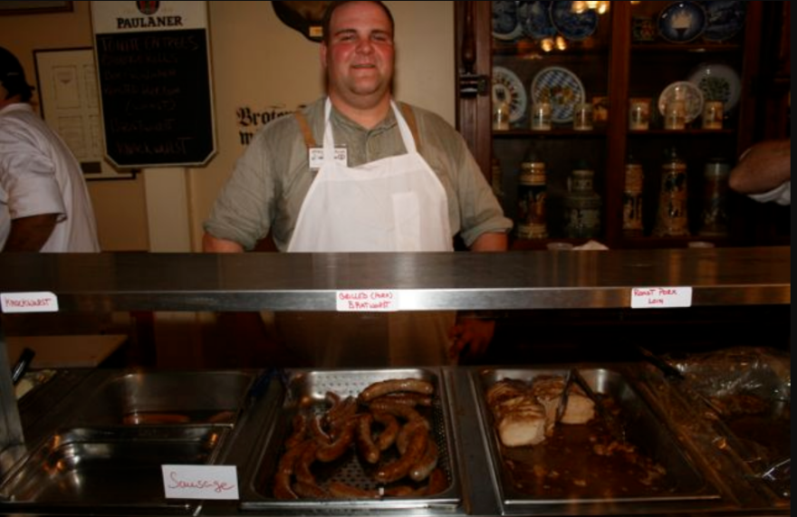 Volunteer members of Deutsches Haus serve traditional German food to the Oktoberfest crowds.