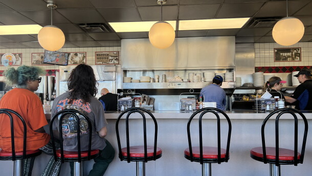 Customers wait for to-go orders at the Waffle House in Navarre after Hurricane Isaias.