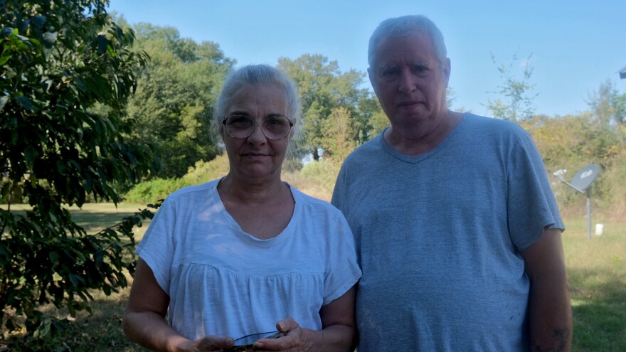 Robin and Joseph Williams stand in their front yard on Friday, October 17, 2025, in Holly Ridge, Louisiana. The couple said that since Meta began construction on the data center across the street, their power goes out without any notice, their water turns “rust-colored,” and they’re afraid to leave their own driveways because of the truck traffic.