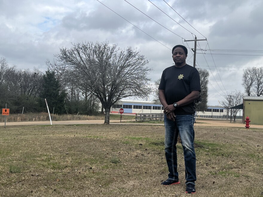 Madison County Constable Johnny Sims stands outside his home down the road from Amazon’s data center campus in Canton, Miss., on Jan. 8, 2026. He blames construction dust from the unfinished facility for worsening his teenage daughter’s asthma symptoms.