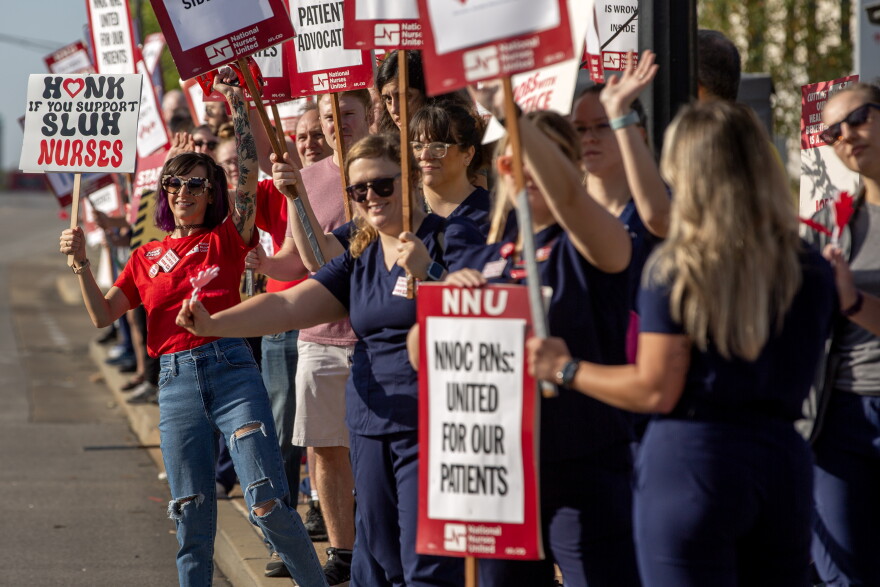Registered nurses hold a 24 hour strike on Monday, Sept. 25, 2023, outside SSM Health Saint Louis University Hospital in Midtown St. Louis. Nurses have been negotiating with the hospital since May, looking for a contract that addresses staffing shortages, increased pay and workplace violence prevention. Nurses gave the hospital advanced notice of the strike to allow for alternative plans to be made for patient care. 
