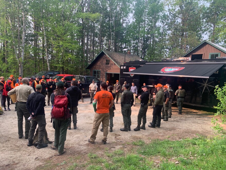Baxter State Park Rangers and the Maine Warden Service briefed search teams before deploying them to search Katahdin for two missing hikers, Tim and Esther Keiderling.