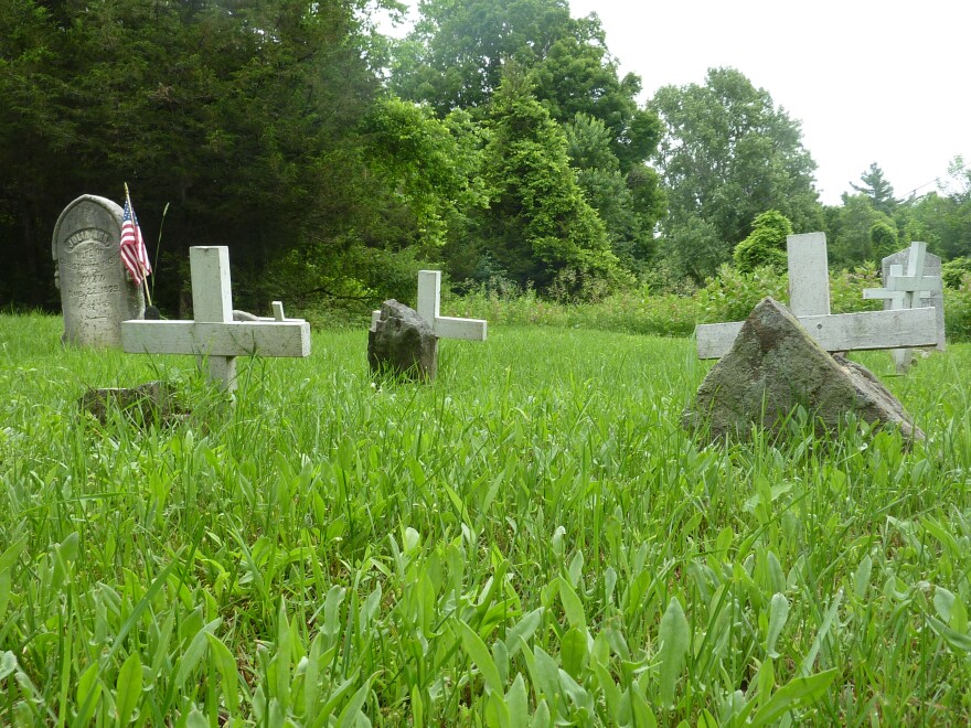 Gravestones mark burial sites in Grindstone Island's official cemetery.