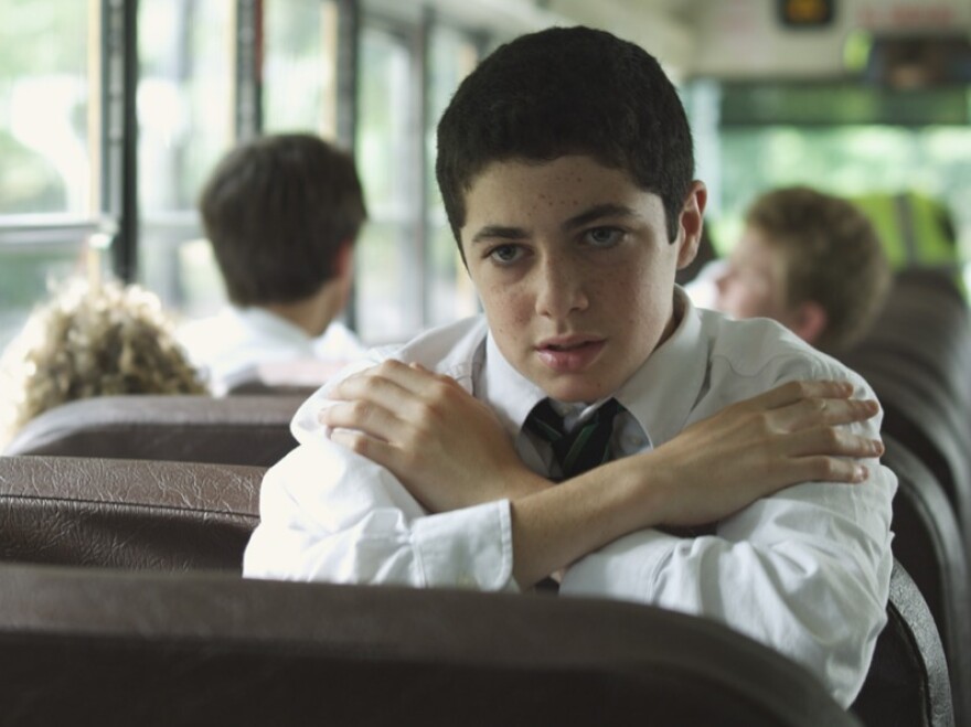 Andy (Dylan Hartigan) must convince a pious fellow altar boy not to give away the details of their afternoons playing hooky.