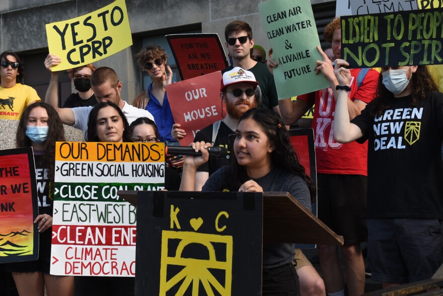 Activist Mahreen Ansari speaks to protestors outside Kansas City Hall last week.