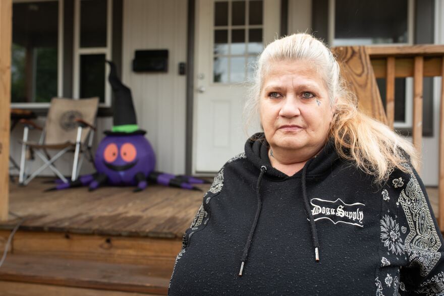 Tania Fowler, a 61-year-old Canton resident, stands in front of her home on Sept. 23, 2025. One of her many Halloween decorations can be seen on the porch.