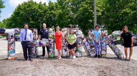 Akron Mayor Shammas Malik, Akron Police Deputy Chief and KAB Vice Chair of the Board Dave Laughlin, Ward 9 Councilwoman Tina Boyes, member of Friends of Prentiss Park Kyla McPhillamy, APS student Khyr’anna Louis, APS student Jayd Foxworth and Executive Director of Keep Akron Beautiful Jacqui Ricchiuti at the unveiling in Prentiss Park on July 9, 2026.