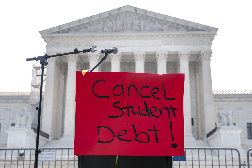 A sign reading "cancel student debt" is seen outside the Supreme Court, Friday, June 30, 2023, as decisions are expected in Washington.