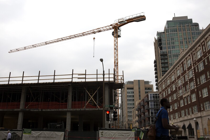 A boutique apartment tower going up at Euclid and West Pine avenues received tax increment financing in 2015. It sits across from a Whole Foods, which is housed on the lower level of another apartment building that received TIF. (Feb. 21, 2017)