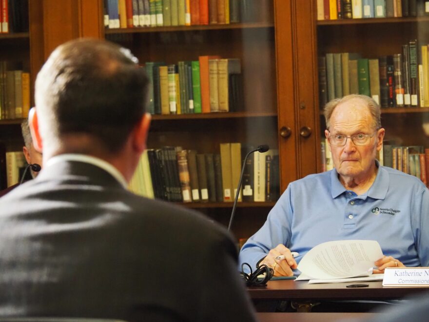 From left: Jason Johnson, the deputy chief of staff of legislative affairs for Gov. Mike Braun, answers a question posed by State Ethics Commission member Robert Duncan on Thursday, April 9, 2026.