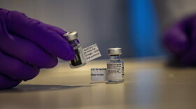 Two vials of Pfizer’s COVID-19 vaccine at Tufts Medical Center. (Jesse Costa/WBUR)