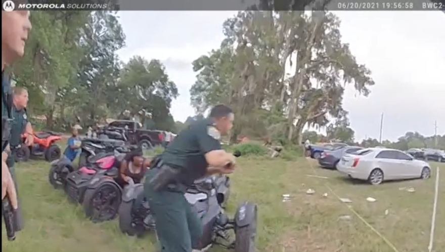 Sheriff's deputies run toward a shooting suspect in Royal Sunday evening in this image from body camera video. Image: SCSO via Facebook