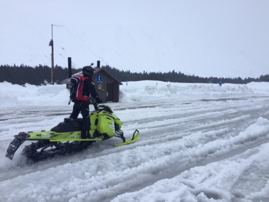 After a couple of quick repairs, Mike Lindemann and Nolan Boedigheimer take off toward a ridge line up Turnagain Pass. Photo: Monica Gokey/APRN.