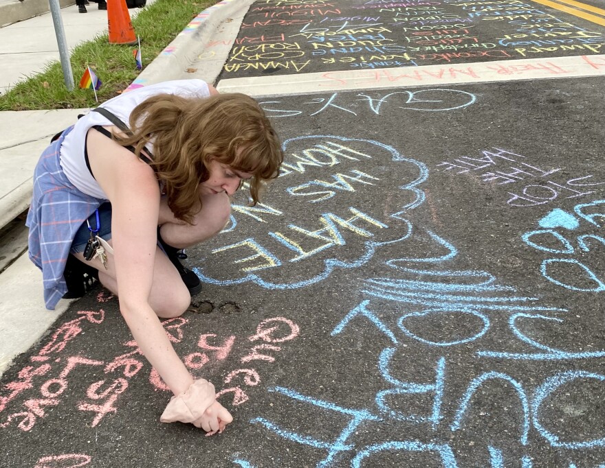 Alexis Bishop was one of many to write messages on West Esther Street near the crosswalk.