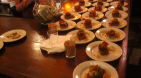 Tapas line the bar at Dante's Kitchen during the monthly Riverbend International Tapas Crawl.