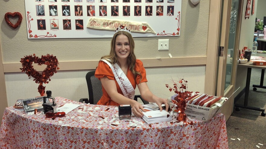 Ellory Anne Bauersfeld, Miss Loveland Valentine 2026, stamping Valentine's Day cards at the Loveland Chamber of Commerce on February 2, 2026.