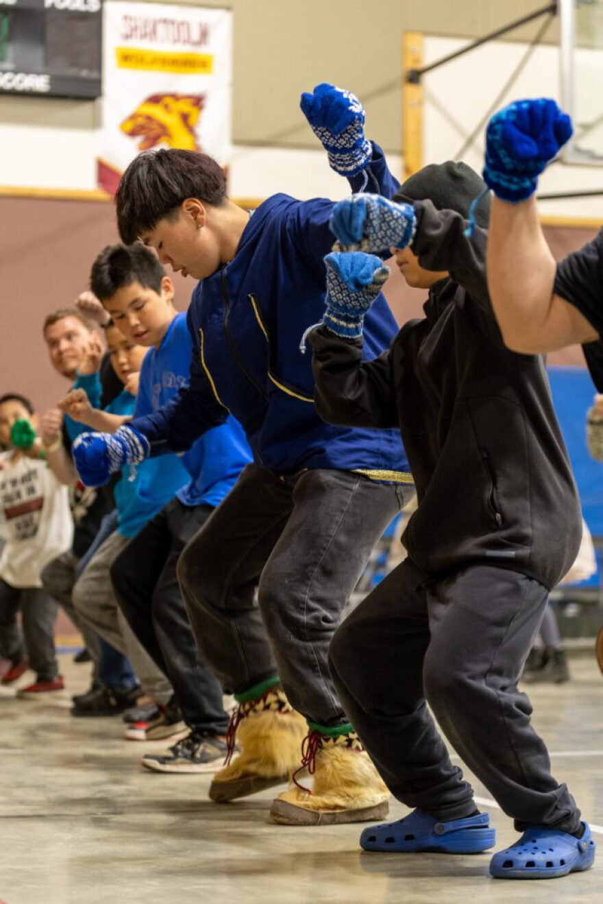 Frank Komonaseak (second in line as pictured) dances during the 25th Annual Kingikmiut Dance Festival.