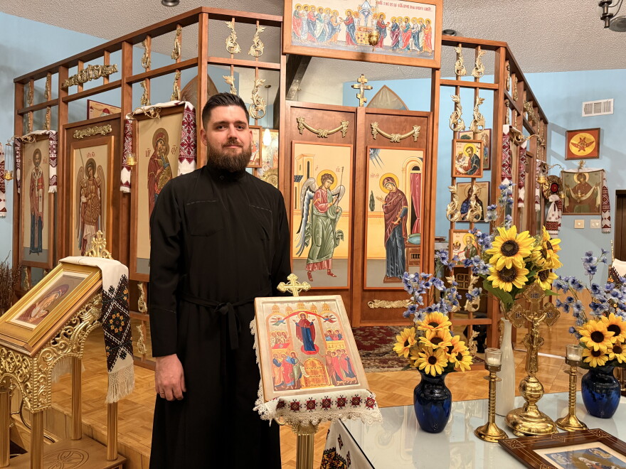 Oleh Zatvarsky poses inside St. Mary's Assumption Ukrainian Catholic Church in south St. Louis County on Wednesday, where he was appointed priest in August. He, along with some of his parishioners, are worried about their futures in St. Louis since their protected status is expiring in a few days.