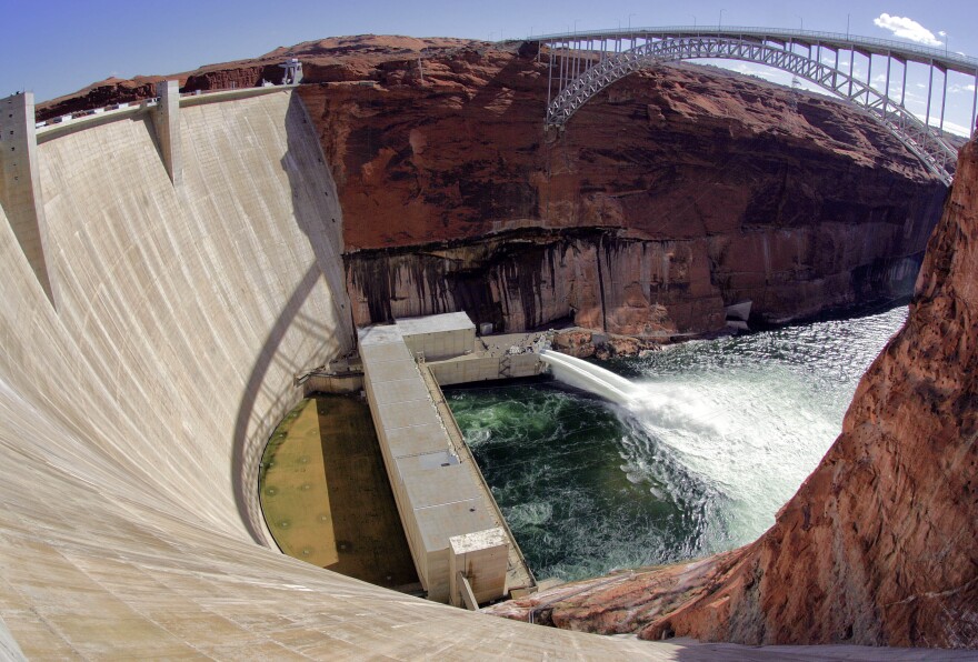 Water flows from the number one and two jet tubes as seen from atop the Glen Canyon Dam, March 5, 2008, in Page, Ariz. The U.S. Bureau of Reclamation decided against sending water rushing through the Grand Canyon this fall to redeposit sediment because of persistent drought. Agency officials said opening the bypass tubes at the Glen Canyon Dam would have reduced the elevation of Lake Powell at a time when it's at historic lows.