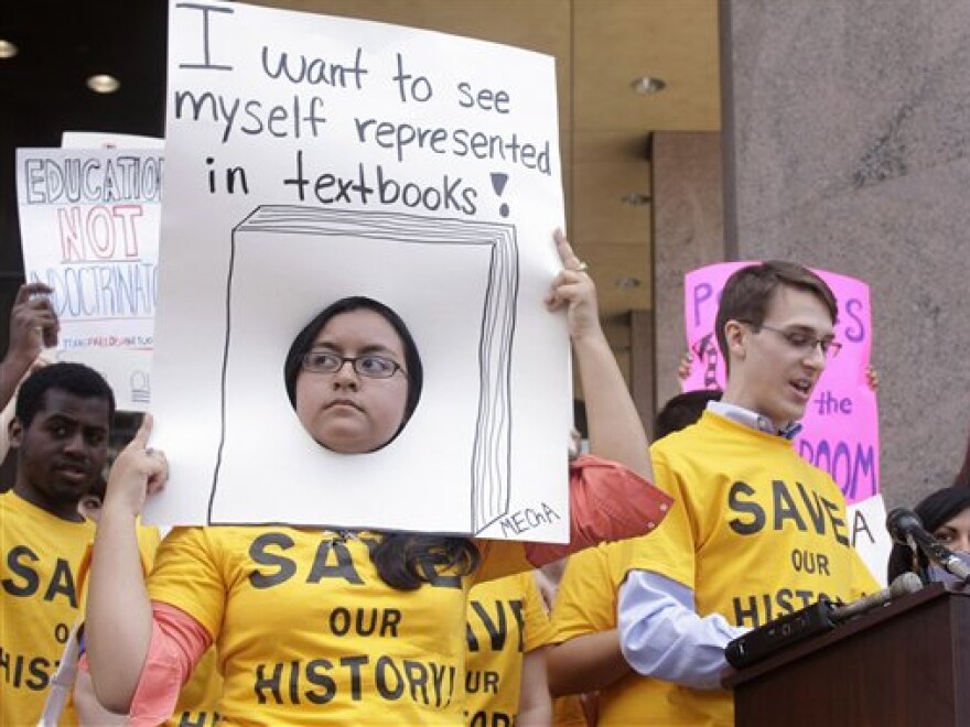 Diana Gomez and Garrett Mize rally before a state Board of Education meeting in Austin, Texas, in 2010.