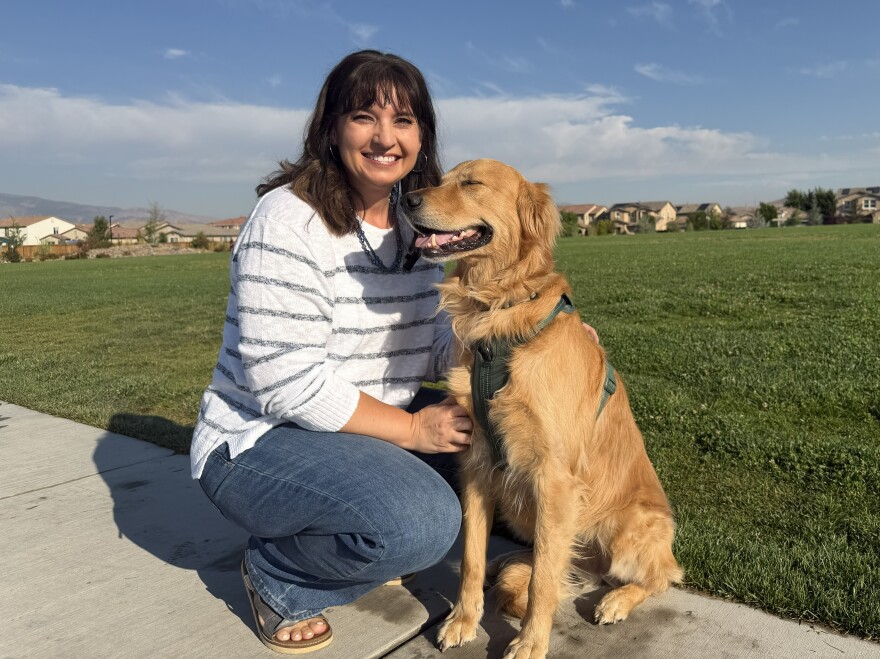 Christine Hull and Milo Bear pose for the camera, sharing a smile on a warm August morning.