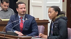 A Buffalo Academy of Science student (right) details her public transportation issues as Fillmore District Councilman Mitch Nowakowski looks on.