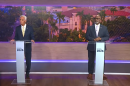 Two men standing at podiums