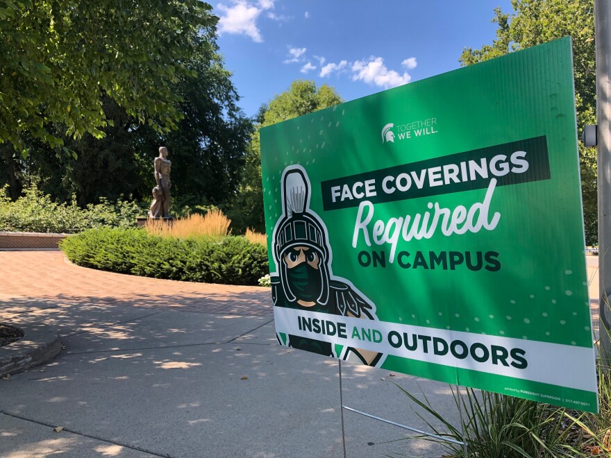 A sign on Michigan State University's campus encouraging people to wear masks.