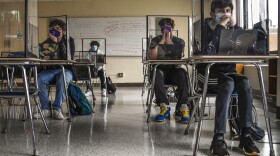 FILE - Students listen to a presentation in Health class at Windsor Locks High School in Windsor Locks, Conn in 2021. The state is still struggling to recover from chronic absenteeism brought on by the pandemic. 