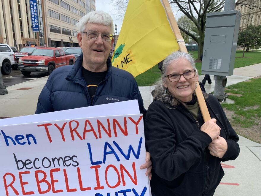 protesters holding signs