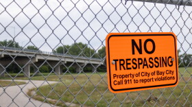 An area near Bay City's Liberty Bridge is contaminated with high levels of toxic metals. Officials are trying to rehome more than 10 people who were staying on the city proeprty.