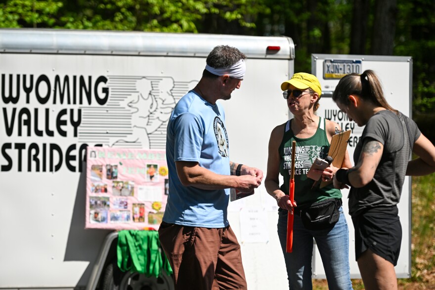 Linda Wojnar-Krasnavage talks with runners Joey and Jill Marchakitus before the race.