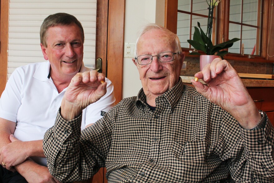 Ed Robinson, who ran the J.C. Robinson Seed Co. for 58 years, with his son Rob Robinson (left).