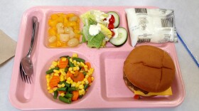 Today's school lunch includes healthier spins on old standards. This meal includes a hamburger with no cheese on a whole wheat bun and a fresh salad, instead of french fries.