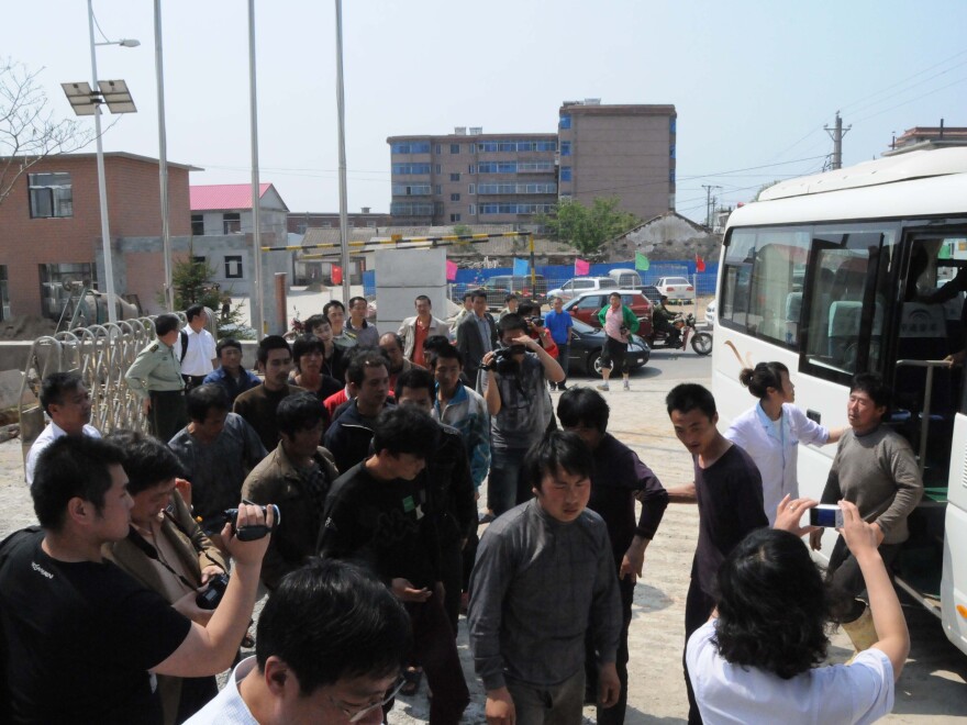 Chinese fishermen — detained for 13 days by North Korea — return to Dalian, in northeast China's Liaoning province, May 21.