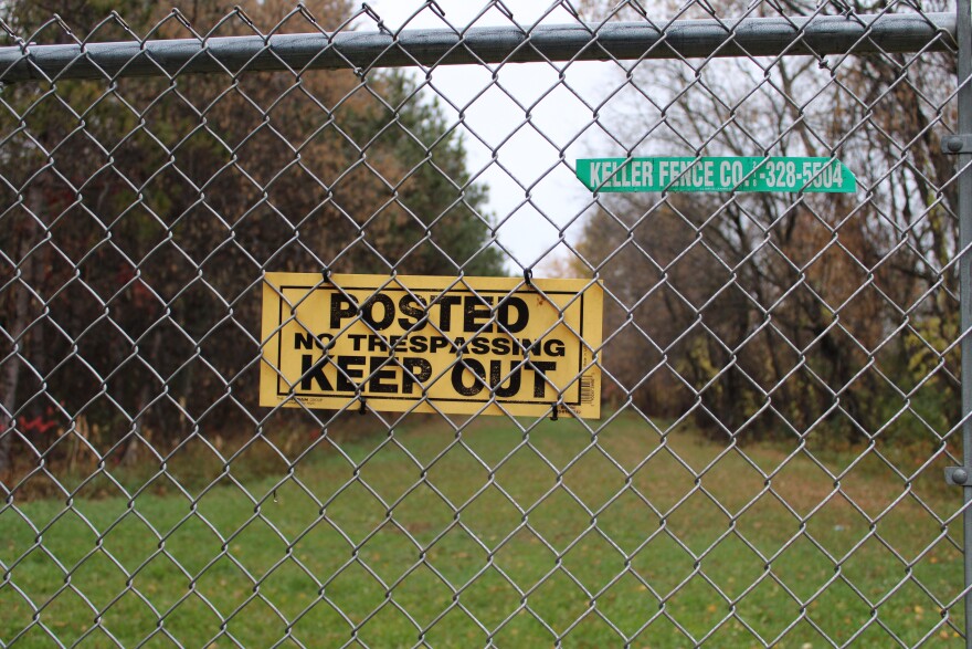 A “Keep Out” sign posted on a fence warns residents and visitors of the St. Regis Paper Co. Superfund site in Cass Lake, Minnesota.