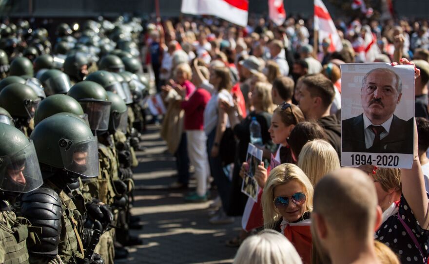 Belarusian security forces block a street during a protest against disputed presidential election results in Minsk on Aug. 30. Tens of thousands of opposition supporters marched through the capital that day, calling for an end to strongman Alexander Lukashenko's rule.