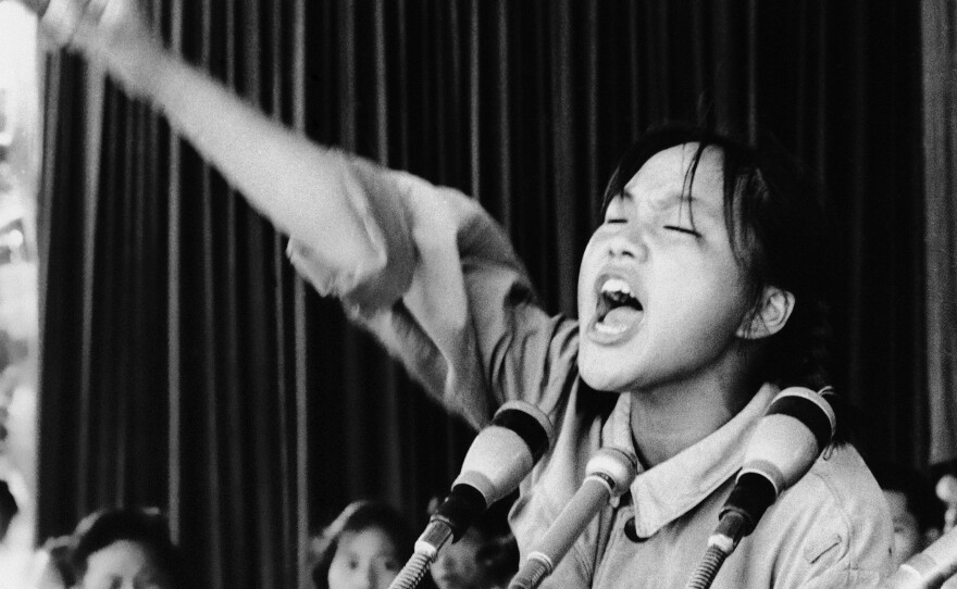 Miss Cho, a 15-year-old high school student and Red Guard leader, exhorts her fellow students during a rally held in Beijing's Tiananmen Square in 1966.