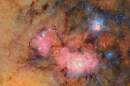 This image provided by the NSF-DOE Vera C. Rubin Observatory shows 678 separate images taken by the observatory in just over seven hours of observing time. Combining many images in this way clearly reveals otherwise faint or invisible details, such as the clouds of gas and dust that comprise the Trifid nebula (top right) and the Lagoon nebula, which are several thousand light-years away from Earth. (NSF-DOE Vera C. Rubin Observatory via AP)