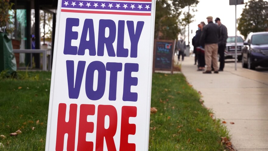 MILWAUKEE, WISCONSIN - OCTOBER 20: Residents wait in line to vote outside of the Tippecanoe branch library on October 20, 2020 in Milwaukee, Wisconsin. Today is the first day of early voting in Wisconsin, which is considered a battleground state for the 2020 presidential election. (Photo by Scott Olson/Getty Images)