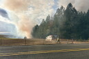 An outdoor burn pile spread to a grove of trees in Lebanon Saturday.