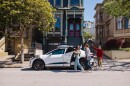 Several riders get into a Waymo vehicle in San Francisco.