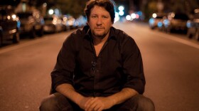 Photographer Chris Arnade found a chair in the middle of the road at 2 a.m., and sat in it for this self portrait.