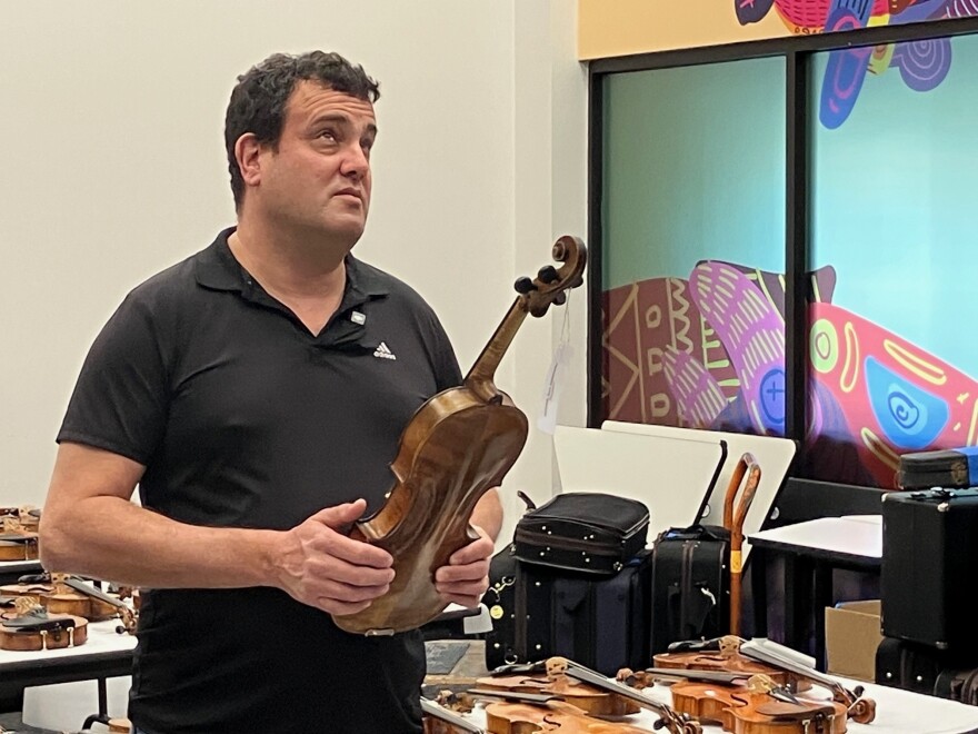Avshi Weinstein talks about the history of the instruments that are part of the "Violins of Hope," to be displayed at the Putnam Museum, Figge Art Museum and German American Heritage Center in Davenport.