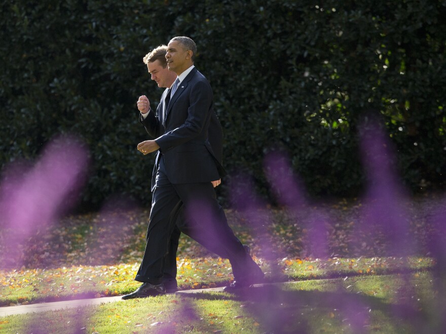 President Obama walks with the chairman of the Democratic Senatorial Campaign Committee, Colorado Sen. Michael Bennet, on the South Lawn of the White House on Wednesday.