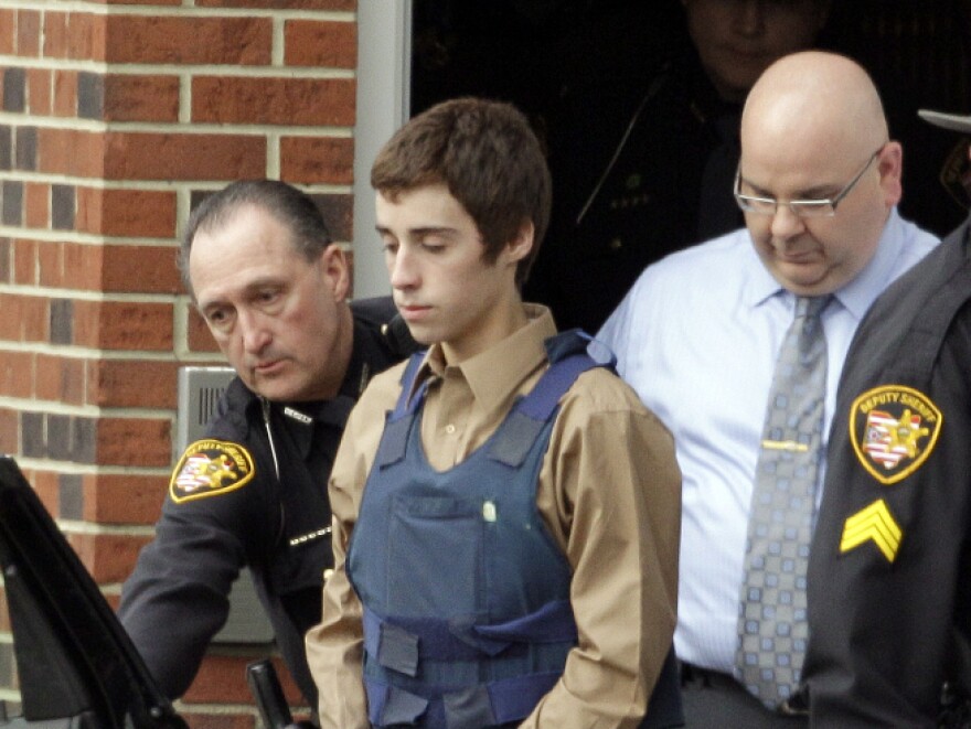 In this Feb. 28, 2012, photo, 17-year-old T.J. Lane is led from Juvenile Court by sheriff's deputies in Chardon, Ohio.