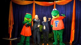 UF presidential candidate David McLaughlin and his wife, Ruth Ann McLaughlin, show their school spirit with Albert and Alberta.