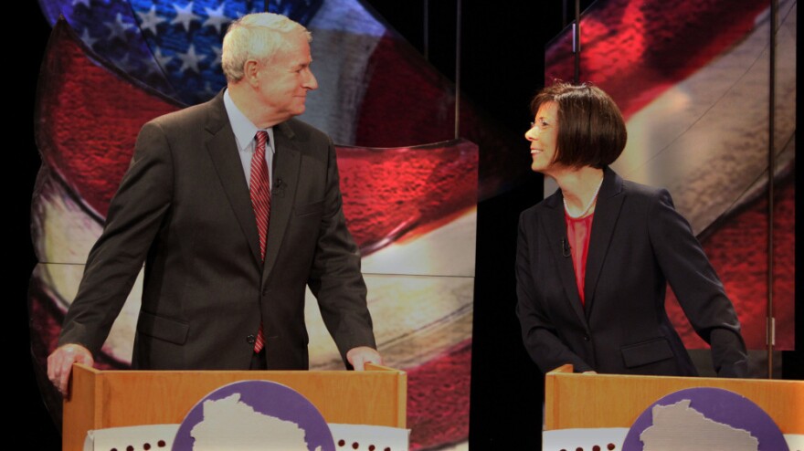 Tom Barrett and Kathleen Falk chat before the start of a live debate for Democratic gubernatorial primary candidates Friday at the Wisconsin Public Television studio in Madison. The front-runners vying for a chance to take on Republican Gov. Scott Walker in a June recall election bashed the governor during the debate. Not pictured are fellow candidates Doug La Follette and Kathleen Vinehout.