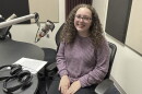 Natalie Harris at the mic in NPR Illinois Studio F.
